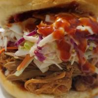 The Hogfather · NoCo Famous Pulled Pork, Served on a Martin’s Potato Roll, Piled High with Our Homemade Cole...