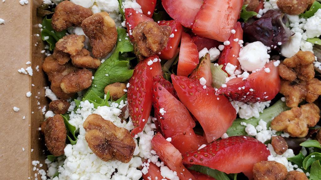 Strawberry Salad · Mixed Greens, Fresh Sliced Strawberries, Goat Cheese and Candied Walnuts, Served with Balsamic Vinaigrette.