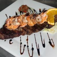 Churrasco Con Camarones · Flank steak with shrimp.