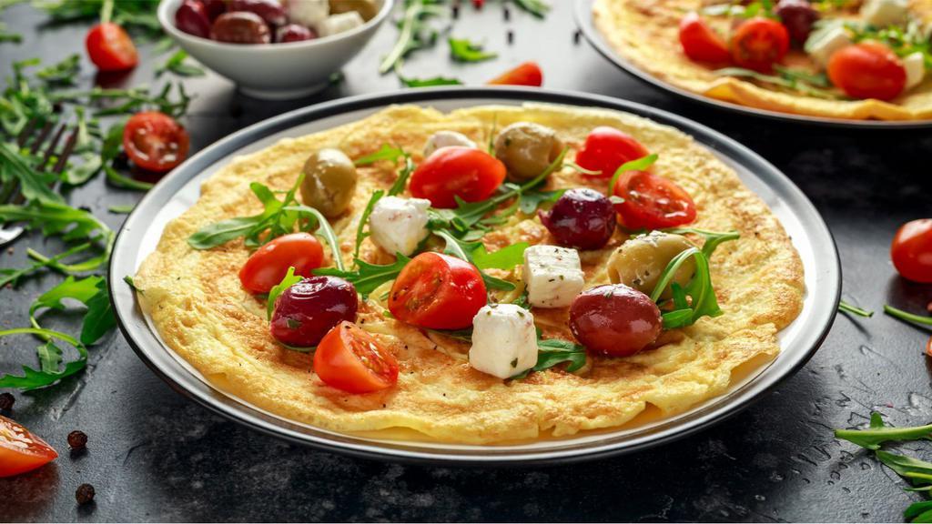 Greek Omelette · 3 delicious eggs with spinach, tomato, onions, feta cheese and toast.