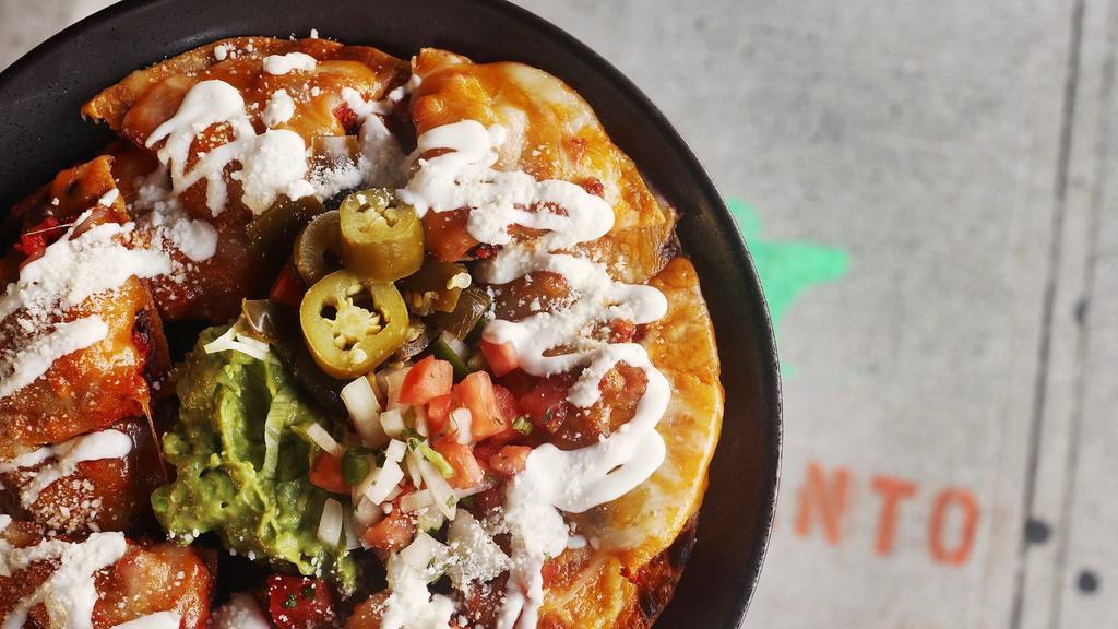 Chorizo Nachos · Tasty Mexican sausage. Topped with melted cheese, black beans, and sour cream. Jalapeños, Pico de Gallo, and Guacamole on the side.