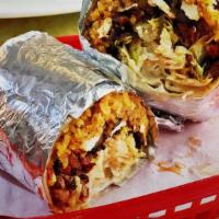 Chicken Burrito · Filled with yellow rice, black beans, cheeses, sour cream, and lettuce.
