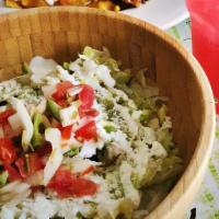 Chicken Burrito Bowl · Grilled chicken with yellow rice, black beans, Oaxaca cheese, pico de gallo, sour cream, and...