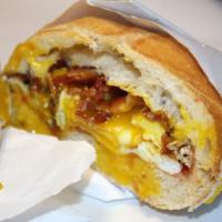 2 Eggs With Meat Sandwich Breakfast · 2 eggs any style with a choice of sausage or bacon on a roll.