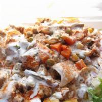 Mix Gyro Over Rice · Chunks of chicken and lamb on rice with lettuce, tomato, onion, green peppers & gyro sauce.