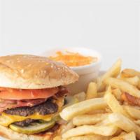 Kid'S Burger (3 Oz.) · Comes with Angus beef patty, ketchup, American cheese, served with fries and kid's drink.