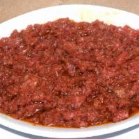 Kitfo · Freshly minced extra lean cut of beef seasoned with chili powder and butter. Cooked to likin...