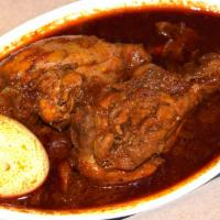 Doro Wat (Chicken Stew Spicy) · Spicy. Two chicken drumsticks stewed with spicy berbere (chili peppers sauce), onion, and gi...