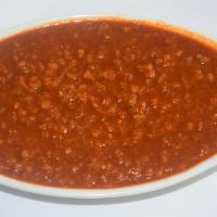 Ye Miser Wat (Lentil) · Spicy lentil. Spilt red lentils cooked with onion and garlic in berbere (chili peppers).