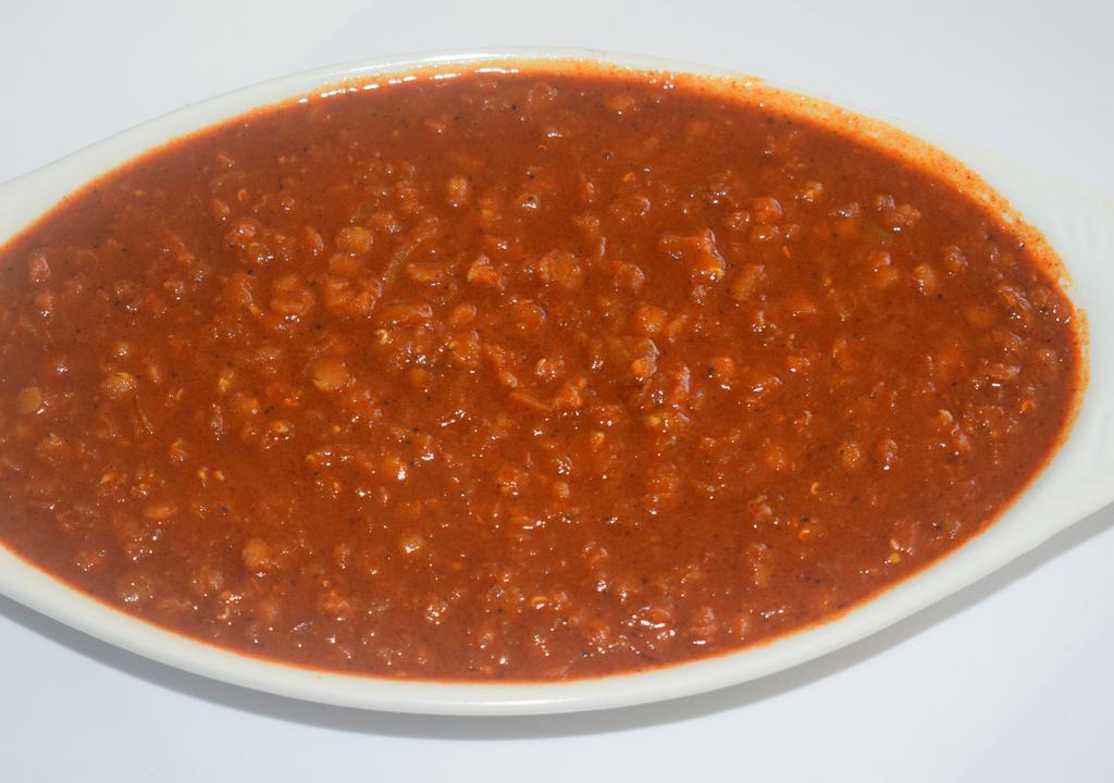 Ye Miser Wat (Lentil) · Spicy lentil. Spilt red lentils cooked with onion and garlic in berbere (chili peppers).