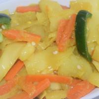 Tikil Gomen (Cabbage) · Cabbage cooked with potato, carrot, onion, olive oil, and fresh garlic.