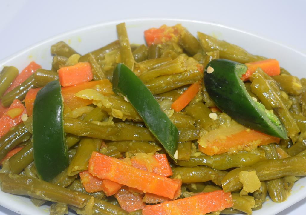 Fossolia (String Beans) · String beans, carrots cooked with onion, olive oil, and fresh garlic.