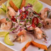 Ceviche De Camaron · Fresh shrimps marinated in lime juice; infused with red onions. Accompanied by Inca corn, po...