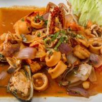 Sudado De Mariscos · Fresh steamed calamari, crab, shrimps and mussels simmered with tomatoes, red onions, and hi...