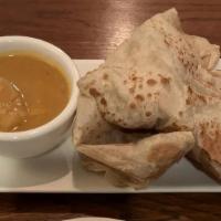 Roti Canai · Spicy. It's the all-time favorite Malaysian crispy Indian style pancake server with curry di...