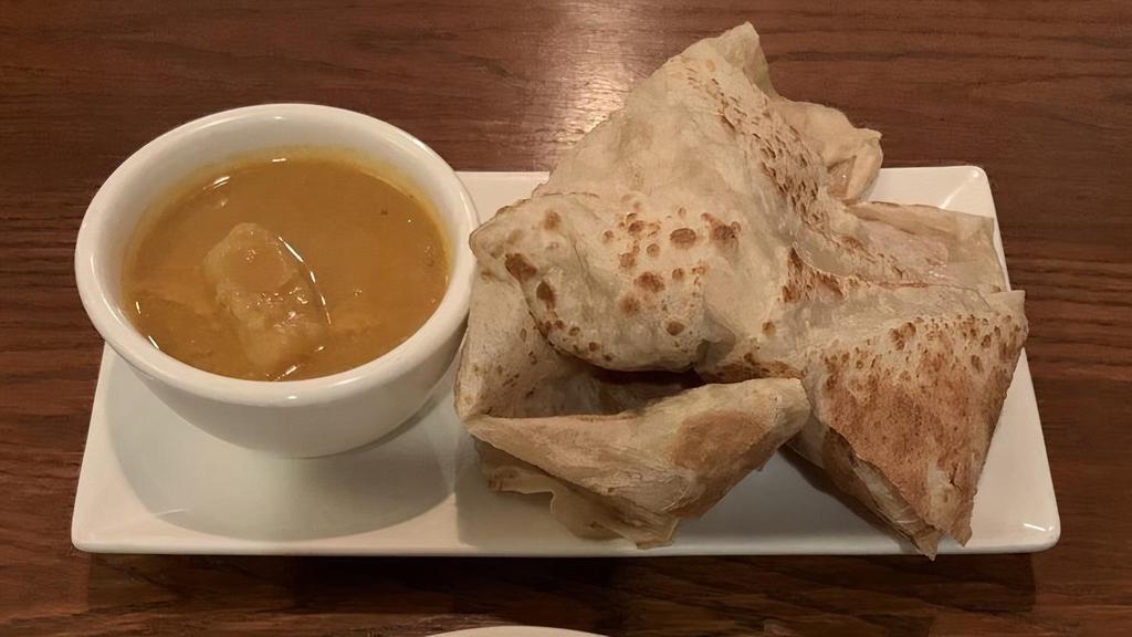 Roti Canai · Spicy. It's the all-time favorite Malaysian crispy Indian style pancake server with curry dipping sauce.