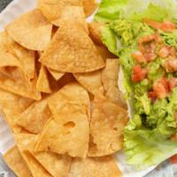 Guacamole With Chips · Our fresh guacamole made on premises served with corn tortilla chips.