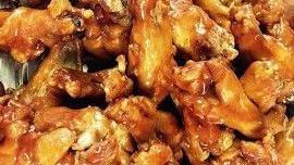 Catering Size: Our Famous Chicken Wings · Includes blue cheese dip. Choice of sauce: buffalo, BBQ, or plain. Request extra hot!.