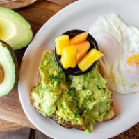 Avocado Toast · Smashed avocado lightly seasoned and spread over whole grain panella bread. Topped with an o...