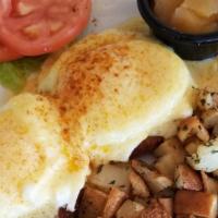 Crab Cake Benedict · Ahoy there! Catch 2 crab cakes and top them with a pair of poached eggs, cover it with holla...
