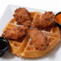 Chicken & Waffles · Our crispy chicken wings served on top of our famous waffle, served with buffalo sauce and s...