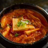 Kimchi Chi Gae Soup · Kimchi stew with tofu, pork belly and rice cake.