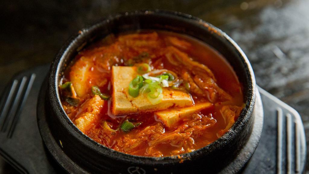 Kimchi Chi Gae Soup · Kimchi stew with tofu, pork belly and rice cake.