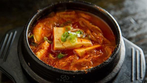 Kimchi Bowl · Traditionally prepared vegetables, kimchi and eggs over rice.