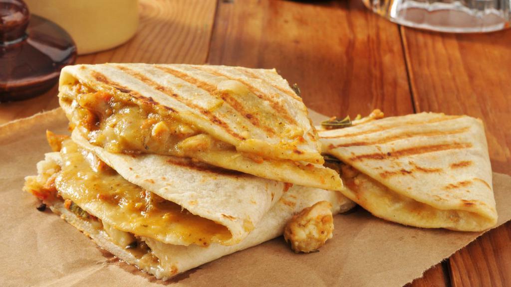 Grilled Chicken Quesadilla · Juicy grilled chicken, jack and cheddar cheese, pico de gallo, salsa, and sour cream on flour tortilla.