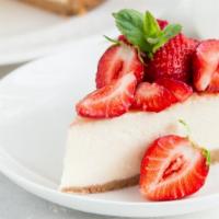 Strawberry Cheesecake · Classic cheesecake with a rich, dense, smooth, and creamy consistency topped with a deliciou...