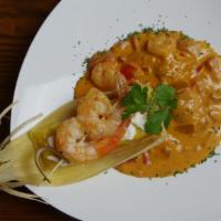 Tamalito Matiz · Cheese corn dough tamale, topped with sour cream, chives served with shrimp in coconut tomat...