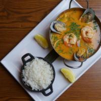 High Seas Soup · Seafood soup, shrimp, clams, green mussels, scallops, calamari, vegetables, coconut milk, an...