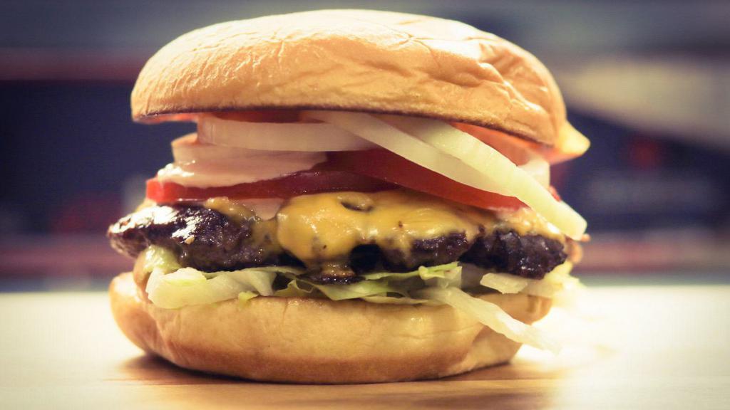 1/4 Pound Everything Cheese Burger · 1/4 cheeseburger seared on the grill on a toasted potato bun, lettuce, tomato, raw onions, pickles, yellow American cheese and our famous house sauce.