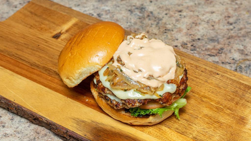 Bigturk · 2 freshly hand pressed turkey burgers, smashed and seared on the grill, served on a toasted Brioche bun, lettuce, tomato, sautéed onions and provolone cheese topped with our #1 requested housemate sauce!