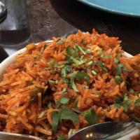 Vegetable Biryani · Gluten free. Vegetables cooked in aromatic saffron and herb infused basmati rice, with a sid...