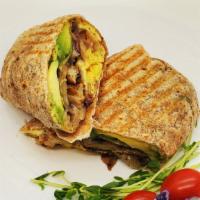Breakfast Burrito · Toasted wrap with Fried eggs, Cheese, Homefries, Avocado and Fried Mushrooms.