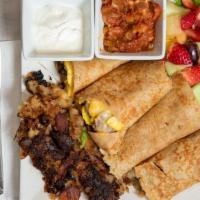 Mexican Crepe Breakfast Burrito · Eggs, peppers, onions, sausage, chili, cheddar and jack cheese, served with home fries, fres...