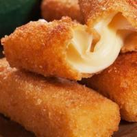Mozzarella Sticks · Tossed in 5 months aged Parmesan cheese served with homemade marinara sauce.