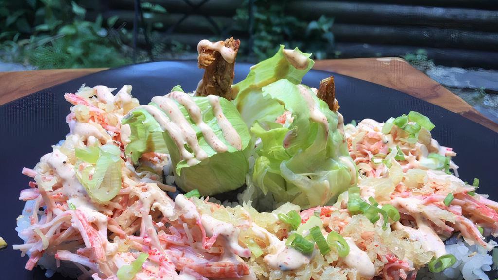 Crab Meat Roll (10 Pcs) · Shrimp Tempura, Avocado, Lettuce, Cucumber topped with Crab Meat.  Spicy Masago Dressing