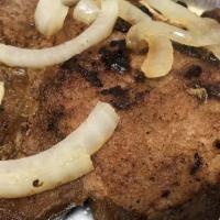 Chuletas De Cerdo A La Plancha · Grilled pork chops.