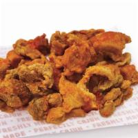 Chicken Cracklins · Marinated Chicken & skin breaded & fried and  topped with Cajun spices.