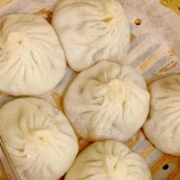 #27.  Szechuan Pork Dumplings · Spicy. 8 Pieces. With Roasted Chili Vinaigrette