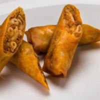 Pastichio Spring Roll · Pasta, meat sauce, crispy phyllo served with bechamel sauce.