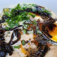 Tonkotsu Ramen · rich pork broth, shoyu-glazed chashu, woodear mushrooms, pickled mustard greens, soft egg, a...