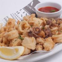 Fried Calamari · Serves two persons. Lightly battered and golden fried calamari served with a side of marinar...