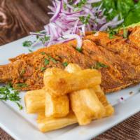 Pargo Entero · Whole red snapper with rice, fried cassava and onion salad.