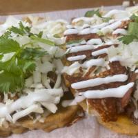 Sopes (1) · One hand made thick tortilla with your choice of sauce , protein, cheese