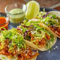 Tacos De Tinga De Pollo (3 Pieces) · Gluten-free. Shredded chicken cooked in a chipotle salsa and queso fresco on handmade corn t...