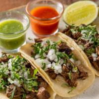 Tacos De Lengua · crispy beef tongue in handmade beet and corn tortillas
topped with onions and cilantro, serv...