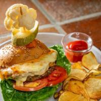 Hamburguesa Mexicana · Ground beef, grilled pineapple, cheese, guacamole, lettuce, tomato, pickled jalapeños, and c...